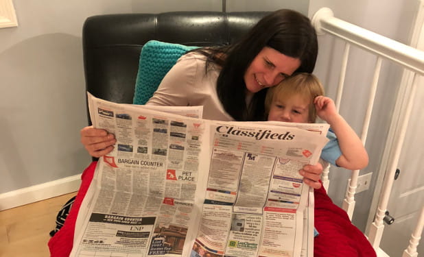 Lucy and Bea looking at classified ads